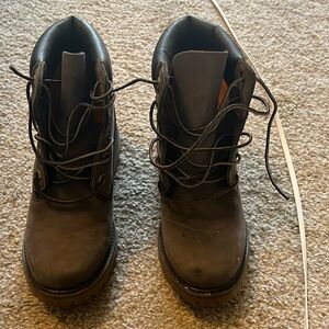 Timberlands with a small heel inside. Worn once, great condition